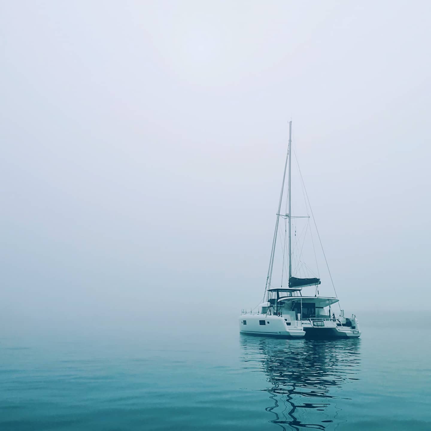 The boat at anchor in the fog